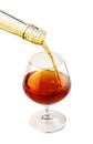 Filling a glass of brandy isolated on white Royalty Free Stock Photo