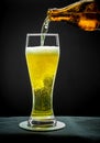Filling glass glass with golden beer on close up Royalty Free Stock Photo