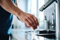 Filling Glass of Water from Faucet