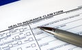 Filling the health insurance claim form Royalty Free Stock Photo