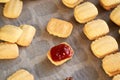 Filling homemade Christmas cookies with strawberry jam, close up