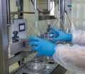 Filling milk into plastic bottles at the factory. equipment in dairy factory. Milk bottling machine Royalty Free Stock Photo