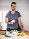 Filling my diet with healthy and nutritious food. Portrait of a handsome young man standing in front of meals which he Royalty Free Stock Photo