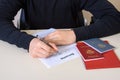 Filling out an employment contract and employment record, passport and diploma on the table Royalty Free Stock Photo