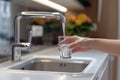 Filling up a glass with clean drinking water from kitchen faucet. Safe to drink tap water Royalty Free Stock Photo