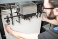 Filling up a paper into the printing machine Royalty Free Stock Photo