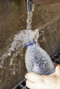 Filling water bottle Royalty Free Stock Photo