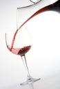 Filling wineglass from decanter Royalty Free Stock Photo