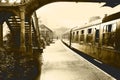 Film black and white steam train and carraiges on the platform at Weybourne Station, Norfolk, England Royalty Free Stock Photo