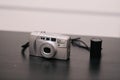 Film camera with film next Royalty Free Stock Photo