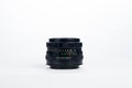 Film camera lens f/2 58mm isolated in white background Royalty Free Stock Photo