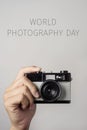 Film camera and text world photography day Royalty Free Stock Photo