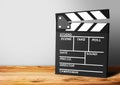 Film Clapboard on wooden background