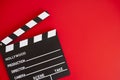 Film clapper on red background Royalty Free Stock Photo