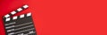 Film clapper on red background Royalty Free Stock Photo