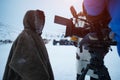 Film crew shooting a caucasian child, in winter Siberian season. Behind the scenes.