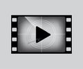 Film frame with play simbol on grey. Vector grunge film strip part. Royalty Free Stock Photo