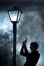 Film noir woman lamppost fog girl gun Royalty Free Stock Photo