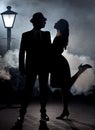 Film noir couple lamppost fog Royalty Free Stock Photo