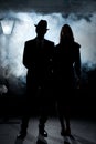 Film noir couple lamppost fog Royalty Free Stock Photo