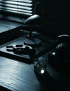 Film noir: detective desktop with revolver and whiskey Royalty Free Stock Photo