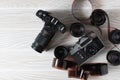 Film old cameras with lenses and manifested film on a white background with copy space. Royalty Free Stock Photo