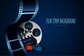 Film reel, clapper board, 3d cinema glasses and twisted cinema tape isolated on blue background. Movie poster template with sample Royalty Free Stock Photo