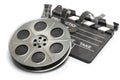 Film reel with clapper board. Video, movie and cinema production concept Royalty Free Stock Photo