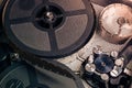 Film reel inside old-fashioned retro movie camera mechanism Royalty Free Stock Photo