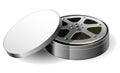 Film reel in open round metal box, old cinema film bobbin in container