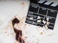 the film in the spiral, near the popcorn, Clapperboard copy space for text, fashion highlights in the photo, concept, film industr Royalty Free Stock Photo