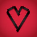 Film strip folded into a heart shape on a red background Royalty Free Stock Photo