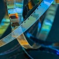 Film strip, old film with scratches, cracks, dust, multicolored abstract colorful background