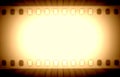 Film strips and light rays Royalty Free Stock Photo