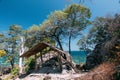 Film style Thailand travel island `Koh Lipe` turquoise sea color with wood cabin viewpoint coast and sunny clear blue sky backgrou