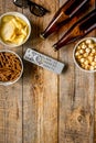 Film whatching party with beer, crumbs, chips and pop corn wooden background top view mockup