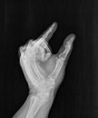 Film xray or radiograph of a hand, thumb and index pinch finger gesture for inch, this much, or small, short, measurement, tiny, Royalty Free Stock Photo