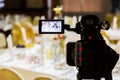 Filming of the event. Videography. Served tables in the Banquet hall Royalty Free Stock Photo