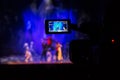 Filming the show from the auditorium. LCD viewfinder on the camcorder. Theatrical performance. The actors on stage Royalty Free Stock Photo