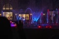 Filming on a smartphone at a show of multi-colored musical fountains at night in Belek, horizontal