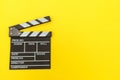 Filmmaker profession. Classic director empty film making clapperboard or movie slate isolated on yellow background. Video Royalty Free Stock Photo