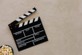 Filmmaking concept. Movie Clapperboard. Cinema begins with movie clappers.Movie clapper board on a light textural background and Royalty Free Stock Photo