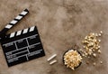 Filmmaking concept. Movie Clapperboard. Cinema begins with movie clappers. Movie clapper board on a textural background and Royalty Free Stock Photo