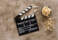 Filmmaking concept. Movie Clapperboard. Cinema begins with movie clappers. Movie clapper board on a textural background and Royalty Free Stock Photo