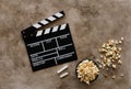 Filmmaking concept. Movie Clapperboard. Cinema begins with movie clappers. Movie clapper board on a textural background and Royalty Free Stock Photo