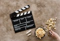 Filmmaking concept. Movie Clapperboard. Cinema begins with movie clappers. Movie clapper board on a textural background and Royalty Free Stock Photo