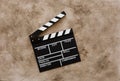 Filmmaking concept. Movie Clapperboard. Cinema begins with movie clappers. Movie clapper board on a textural background Royalty Free Stock Photo