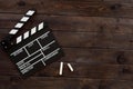 Filmmaking concept. Movie Clapperboard. Cinema begins with movie clappers. Movie clapper board on a wooden background Royalty Free Stock Photo