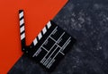 Filmmaking concept. Movie Clapperboard. Cinema begins with movie clappers. Movie clapper on a dark and red background Royalty Free Stock Photo