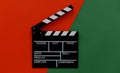 Filmmaking concept. Movie Clapperboard. Cinema begins with movie clappers. Movie clapper on a green and on a red background Royalty Free Stock Photo